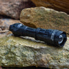 Nightfox XB5 Pro INFRARED LED TORCH - 850nm place on a rock | Wet