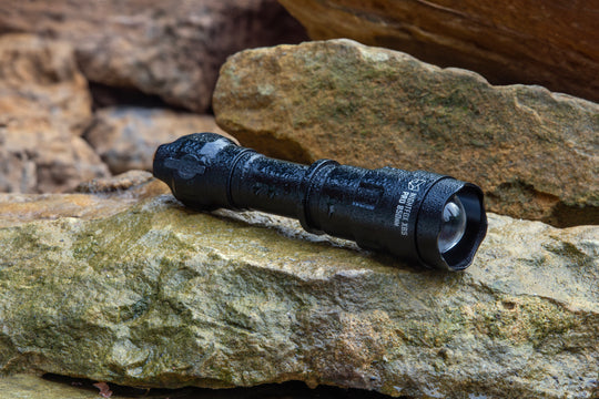 Nightfox XB5 Pro INFRARED LED TORCH - 850nm place on a rock | Wet